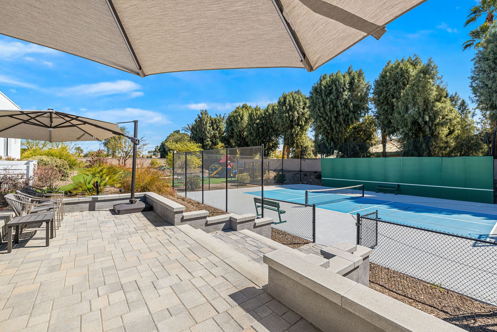 Pickleball court below a shaded seating terrace at Sierra Vista in Rancho Mirage